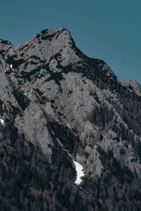 Scenic view of snowcapped mountains against clear sky