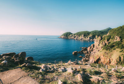 Scenic view of bay against sky