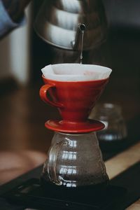 Close-up of coffee filter in cup on table