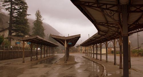 Empty road along built structures