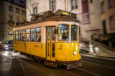 Yellow bus on road against sky
