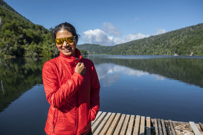 Beautiful woman at still lake in the chilean lake district