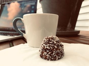 Close-up of coffee cup on table