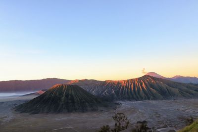 View of volcanic mountain against sky during sunset