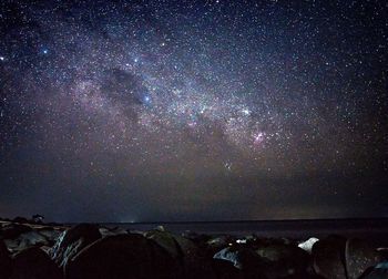 Scenic view of star field against sky at night