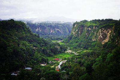 High angle view of trees and mountains against sky