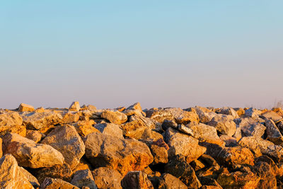 Rock formations against clear blue sky