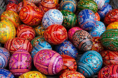 Full frame shot of multi colored eggs for sale at market