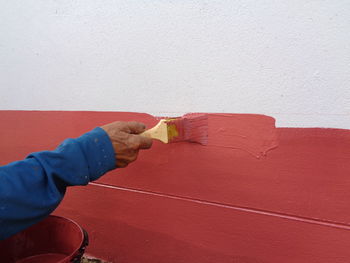 Person working on wall