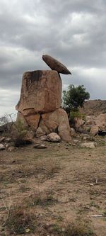 Rock formations on landscape against sky