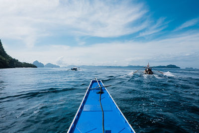 Sailboat in sea against sky