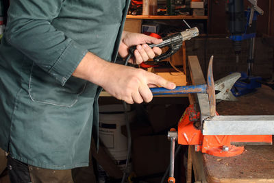 Man working on barbecue grill