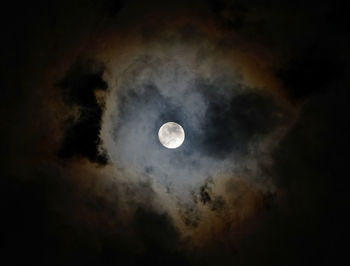 Low angle view of moon against sky at night
