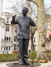 Statue of people in front of temple