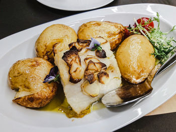 Close-up of portuguese style potato and cod fish in plate. 