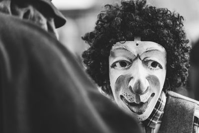 Ancient carnival of sauris. traditional wooden masks. black and white. italy