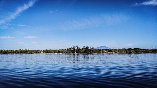 Scenic view of lake against blue sky