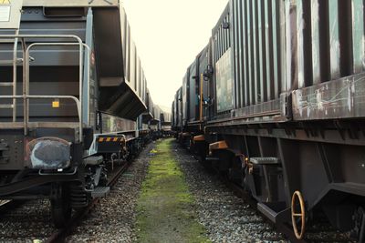 Trains at shunting yard against sky