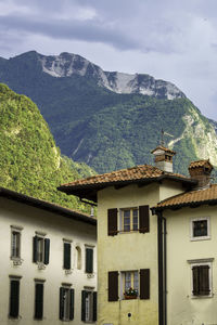 Houses and mountains against sky