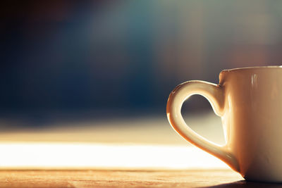 Close-up of coffee cup on table