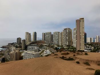 Buildings in city against sky