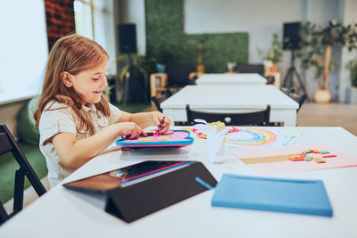 Child doing homework in after school club. back to school. learning at primary school. elementary