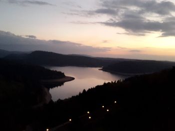 Scenic view of lake against sky during sunset