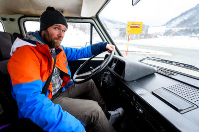 Portrait of man driving truck