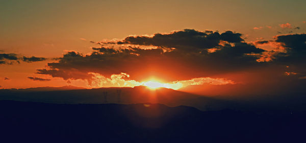 Scenic view of dramatic sky during sunset