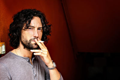 Portrait of man smoking cigarette