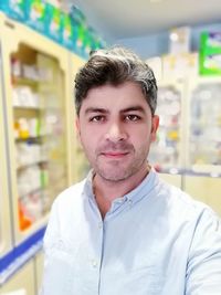 Portrait of man standing in store