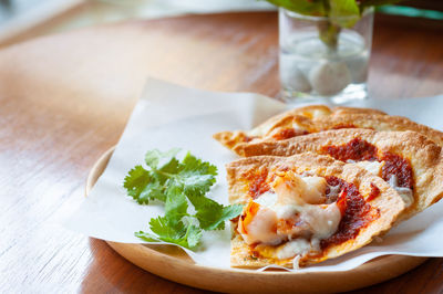 High angle view of pizza in plate on table