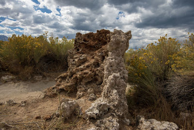 View of rock formation on landscape against sky