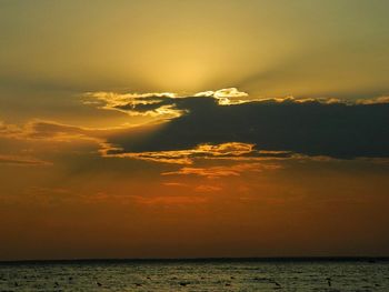 Scenic view of sea against dramatic sky