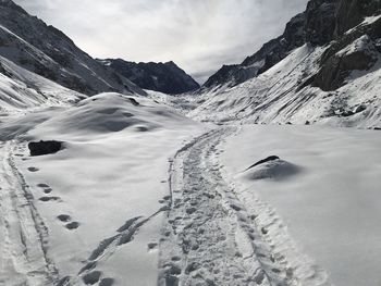 Scenic view of snowcapped mountains against sky