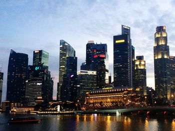 Low angle view of illuminated cityscape against sky