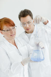 Two scientists working in laboratory