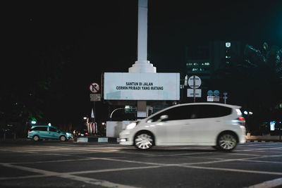 Car on city street at night