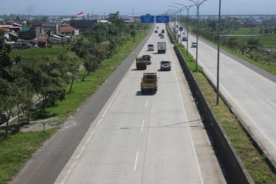 High angle view of vehicles on road in city