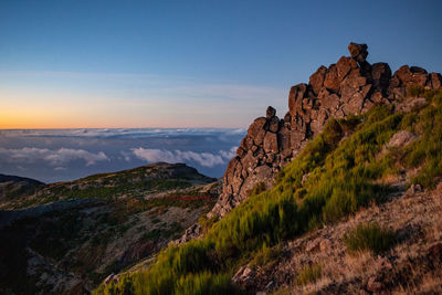 Scenic view of rocky mountains against sky