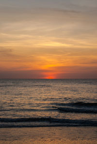 Scenic view of sea against romantic sky at sunset