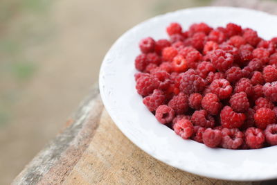 Close-up of raspberries in bowl on table