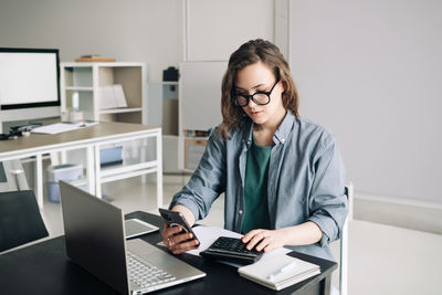 Businesswoman working at office