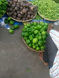 Low section of man selling vegetables at street market