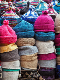 Stack of woolen hats for sale at market stall