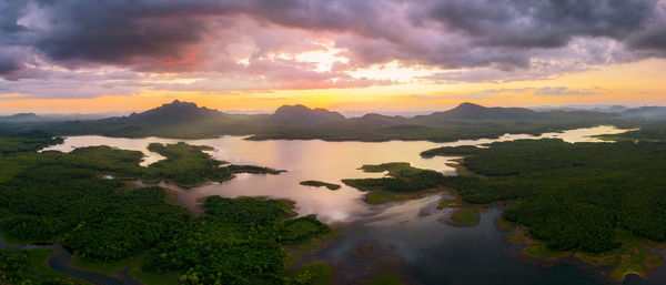 Scenic view of lake against sky during sunset