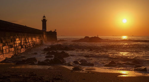 Scenic view of sea against sky during sunset