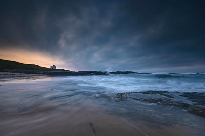 Scenic view of sea against sky during sunset