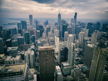 High angle view of modern buildings in city against sky