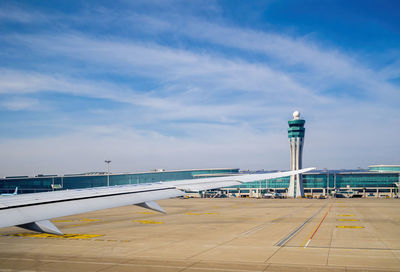 Airport runway against sky